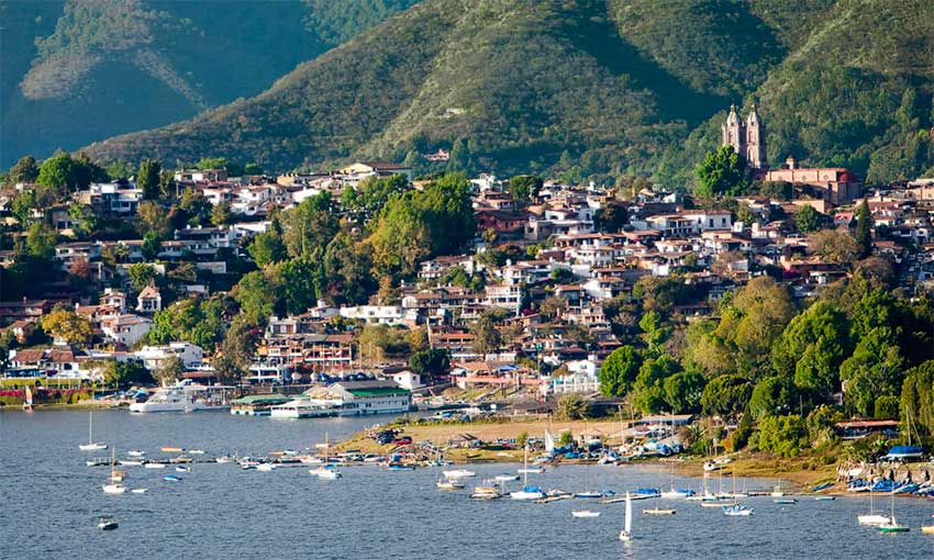 Valle de Bravo lakeside town with boats and mountains